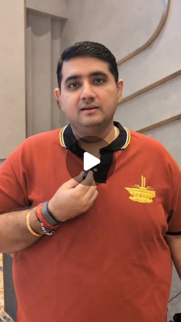 A speaker holding a microphone in the official reel about informal trips